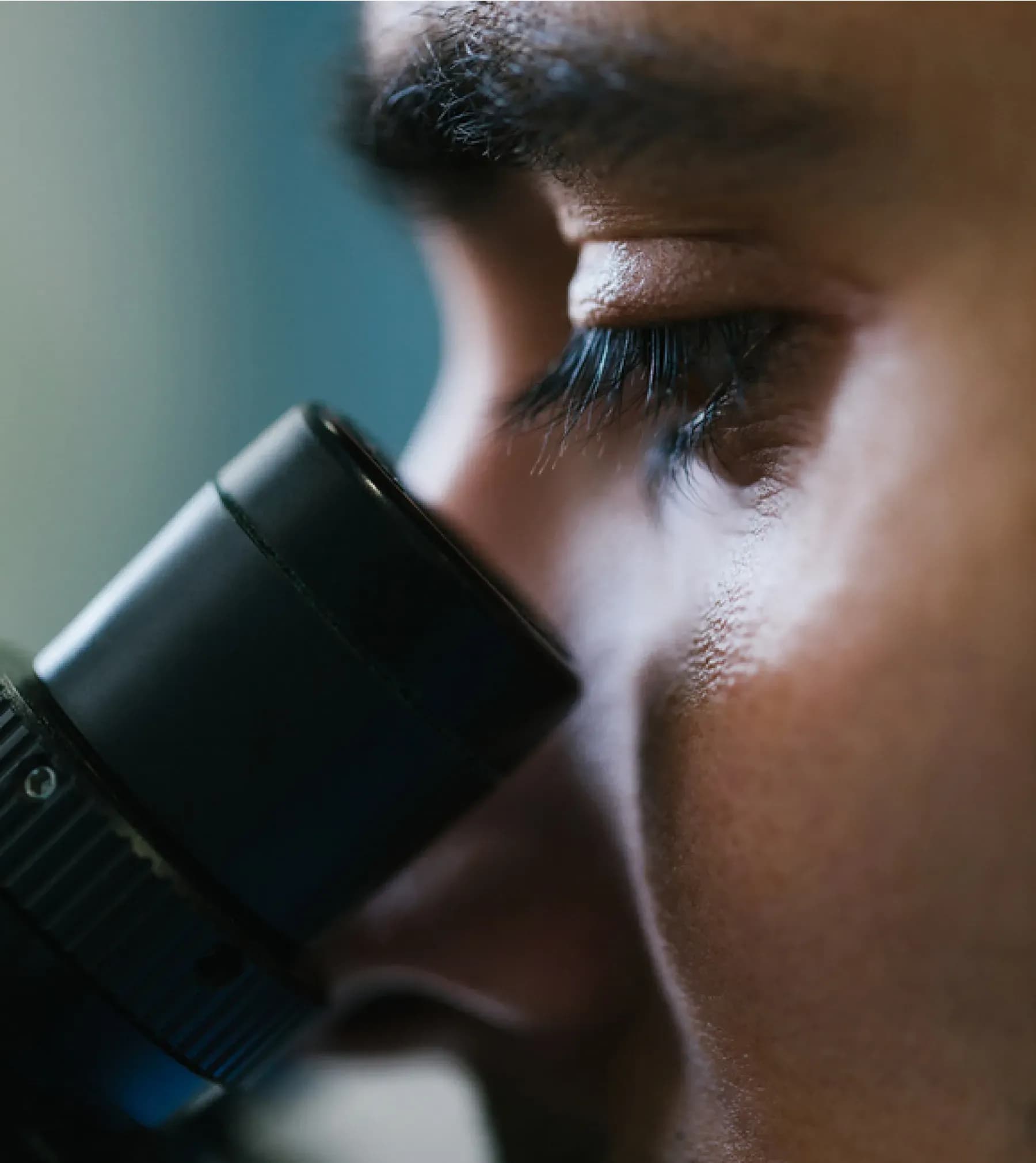 Laboratory researcher using microscope